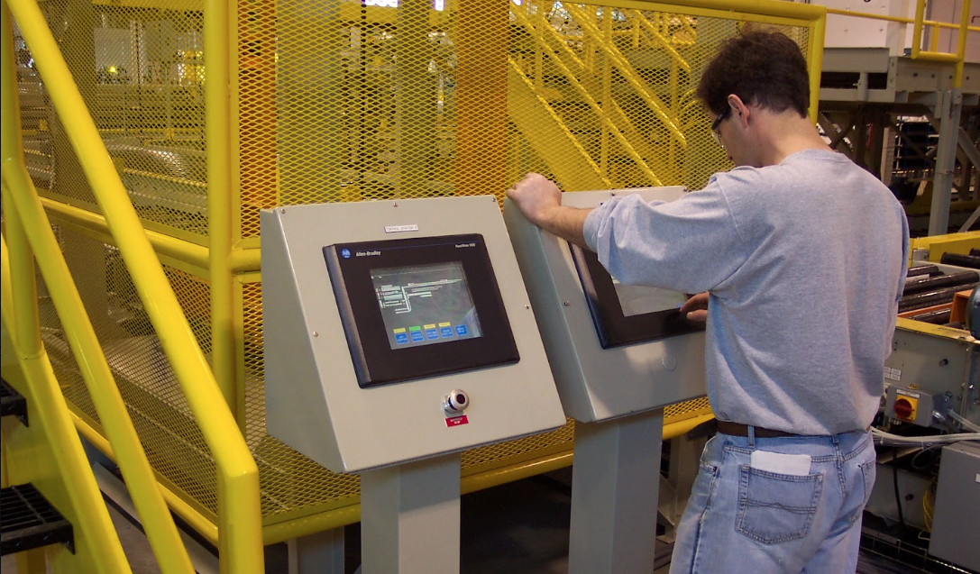 Allen-Bradley PLC panel and HMI in an active industrial environment
